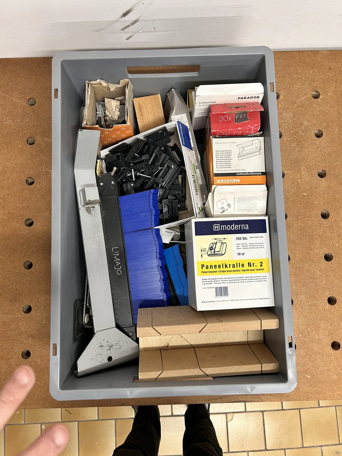Euro container photographed from above: fittings and small parts